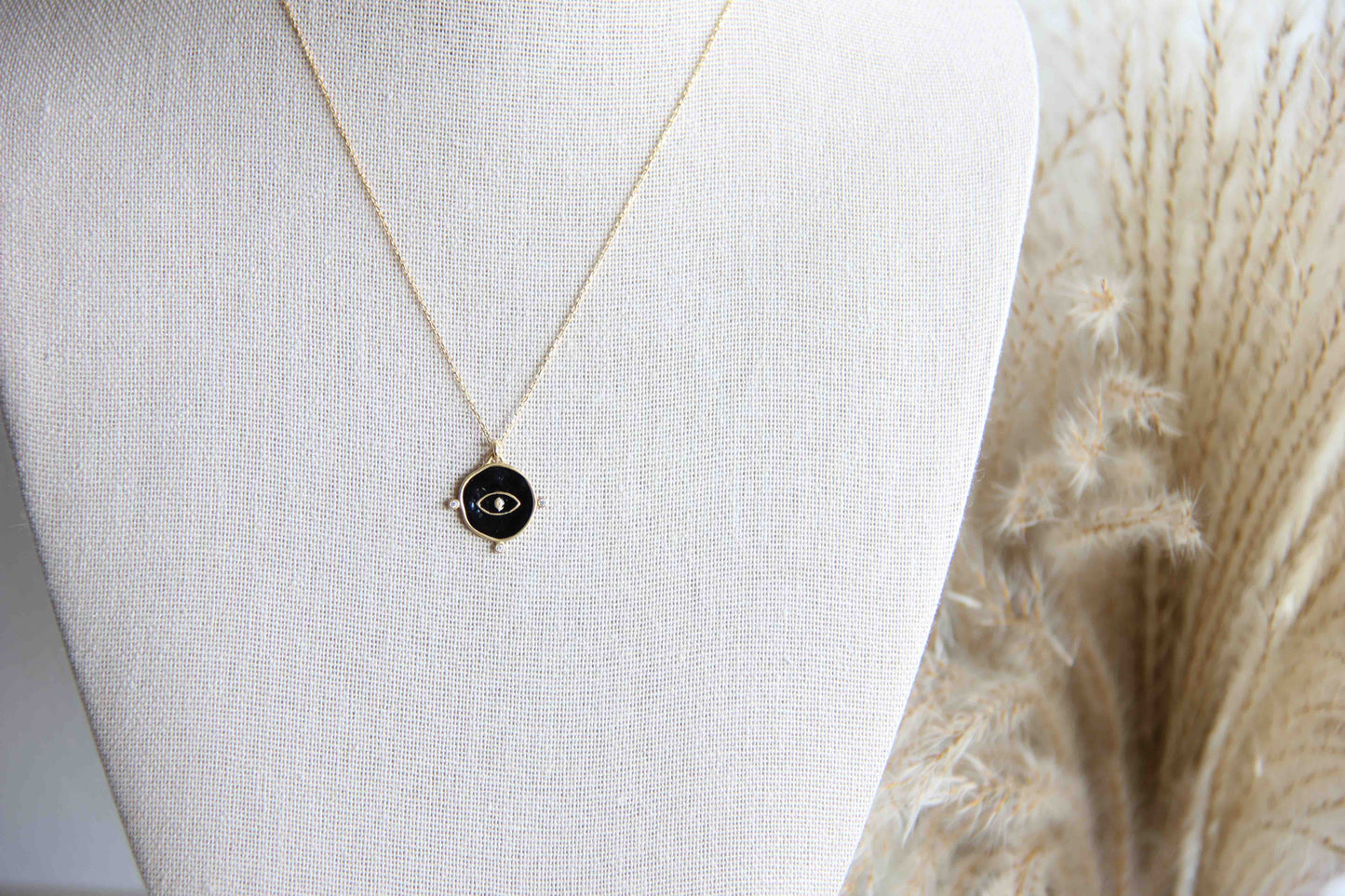 This gorgeous minimal gold evil eye necklace are made with 18k Gold Plated on solid 925 sterling silver and has 3 mini cubic zirconias around the charm.